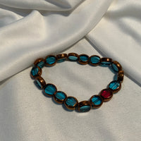 Turquoise with Antique Brass & One Red Bead, Beaded Bracelet