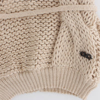 Beige sleeveless knitted cardigan