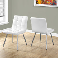 Two 31.5" Leather Look, Foam, Polyurethane, and Chrome Metal Dining Chairs