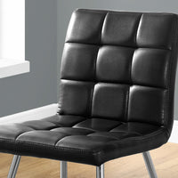 Two 31.5" Black Leather Look, Foam, Polyurethane, and Metal Dining Chairs