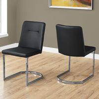 Two 34" Black Leather Look and Foam Dining Chairs with Chrome Legs
