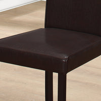 Two 36" Leather Look, Solid Wood, Foam, and MDF Dining Chairs