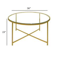 Round Metal Coffee Table With Glass Top and X Shape Base, Gold and Clear