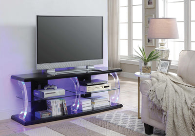 Wooden TV Stand with Acrylic Posts and Four Open Compartments, Black and Clear