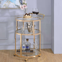 Three Tier Metal Serving Cart with Glass Inserted Shelves and Curved Side Handle, Gold and Clear