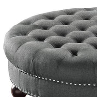 Fabric Upholstered Round Tufted Ottoman with Wood Legs, Gray and Black