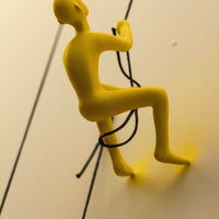 6" x 3" x 3" Resin Yellow Climbing Man