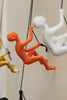 6" x 3" x 3" Resin Orange Climbing Man