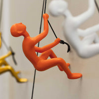 6" x 3" x 3" Resin Orange Climbing Man