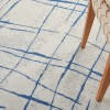 6’ x 9’ Ivory and Blue Irregular Grids Area Rug