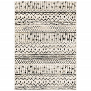 7’ x 9’ Ivory and Black Eclectic Patterns Indoor Area Rug