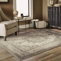 5’x8’ Ivory and Gray Pale Medallion Area Rug