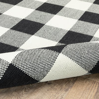 8’ Round Black and Ivory Gingham Indoor Outdoor Area Rug