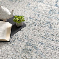 8’ x 11’ Ivory and Blue Abstract Distressed Area Rug