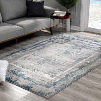 8’ x 11’ Ivory and Blue Abstract Distressed Area Rug